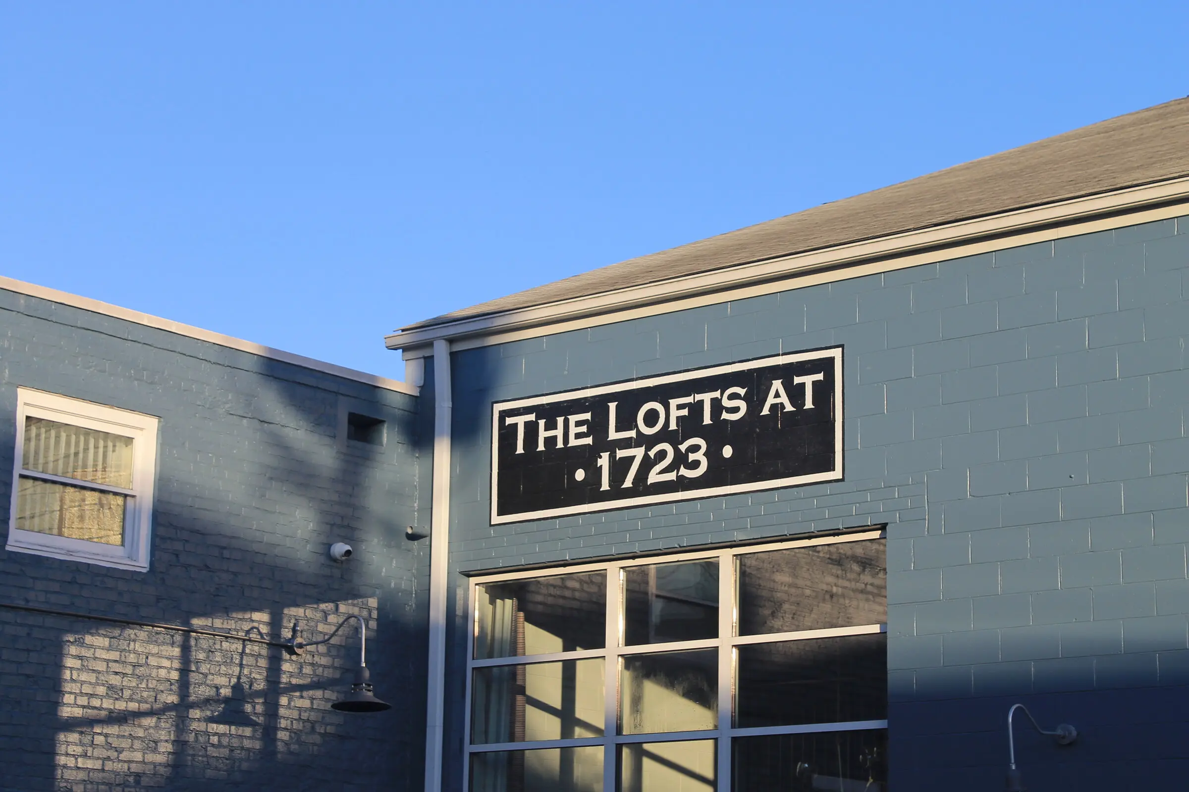 The Lofts at 1723 in Richmond's Scott's Addition, its name painted on the building above the entrance.